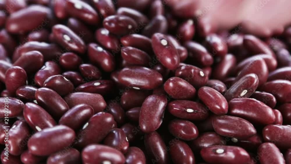 red bean texture in the background. natural products background. Hand stirred the beans red bean texture in the background. natural products background. Hand stirred the beans