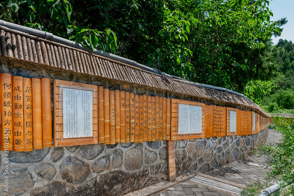 Travel photo of house near green trees.