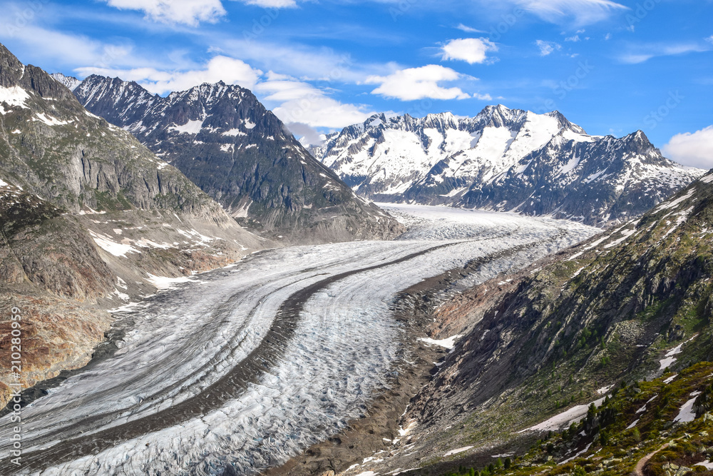 Stunning view of Aletsch glacier in the Bernese Alps in Switzerland, seen from a mountain near the village of Bettmeralp. Aletsch glacier is the largest glacier in the alps. Famous tourist destination
