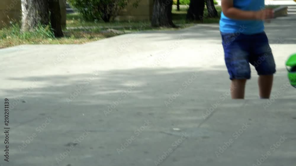 The little cute boy is having fun with his toys in the park. 4K The little cute boy is having fun with his toys in the park. 4K