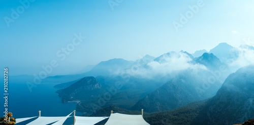 Abstract mountain background with copy space- concept of tourism and travel. Layers of ridges in Tunektepe Teleferik near Anntalia at sanrise sky photo