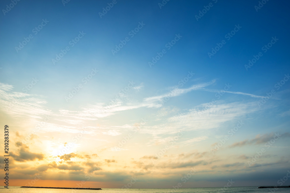 Beautiful early morning sunrise over the sea the horizon,blue sky background  texture with white clouds sunset. Stock Photo | Adobe Stock
