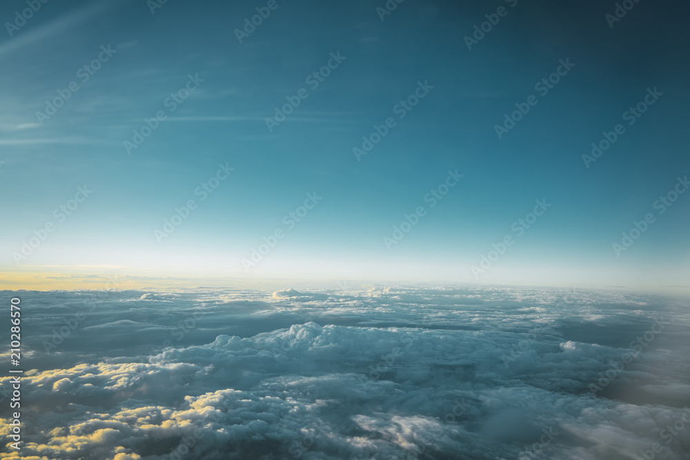 View of white clouds in blue sky from above View of white clouds in blue sky from above