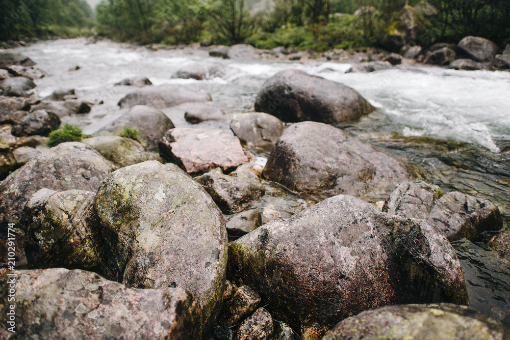 Rocks in stream with smooth flowing water Rocks in stream with smooth flowing water