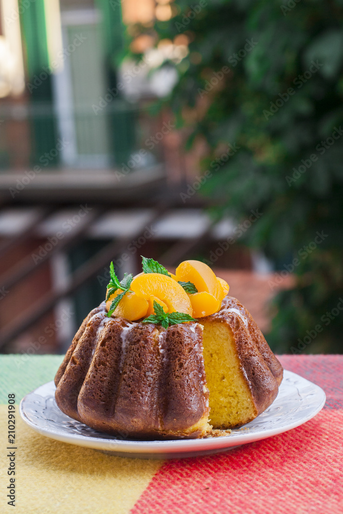 Rum Baba yeast cake (homemade) saturated in syrup made with rum