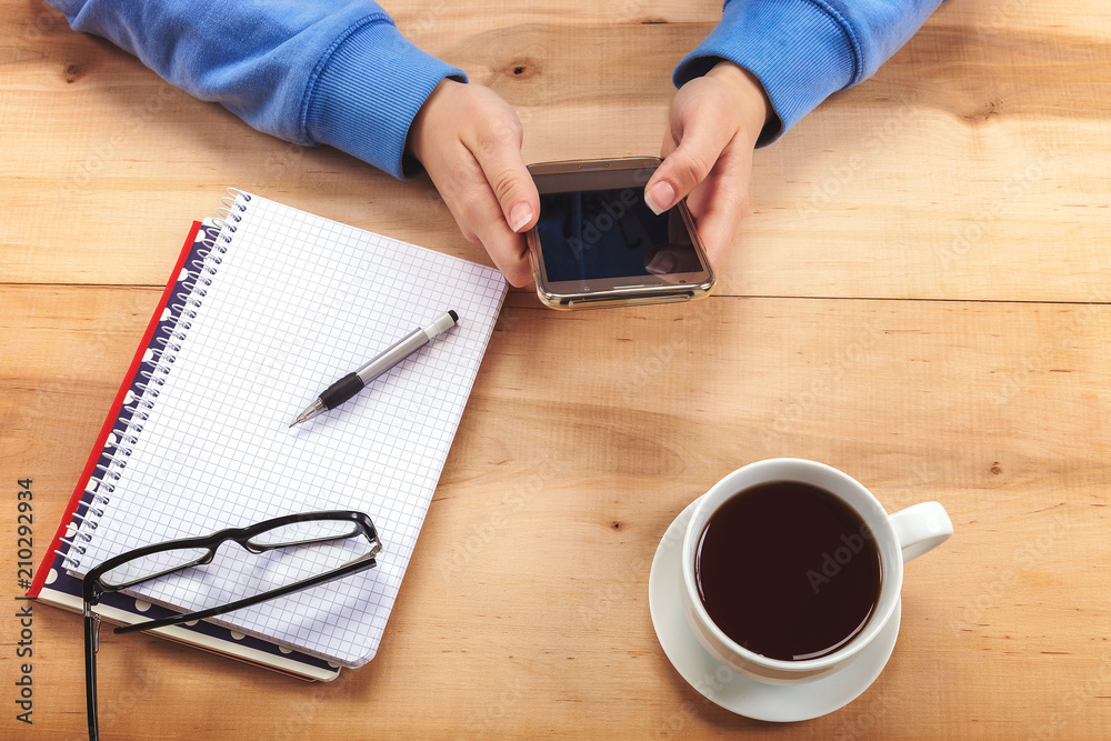 Girl with a mobile phone and stationery. Girl with a mobile phone and stationery.