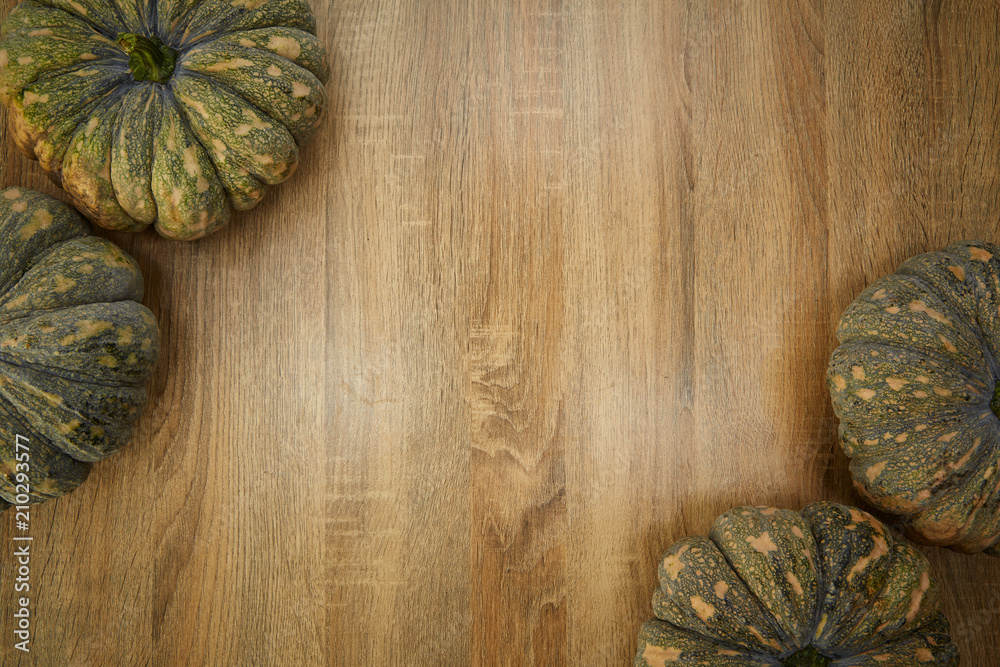 Fototapeta premium Pumpkins against a rustic