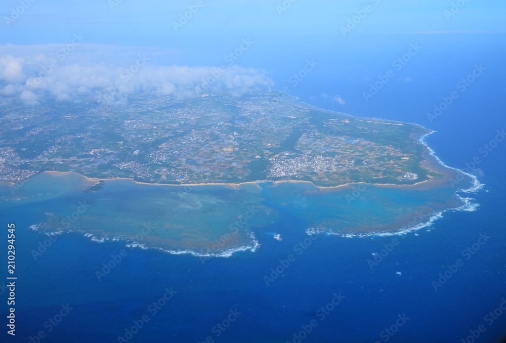 Beautiful blue sky and white cloud and landscape view from the plane in Japan Okinawa Beautiful blue sky and white cloud and landscape view from the plane in Japan Okinawa