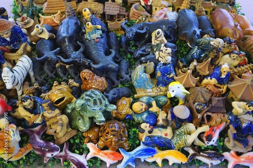 Colorful ceramic figures for sale at a market outside Hanoi Vietnam