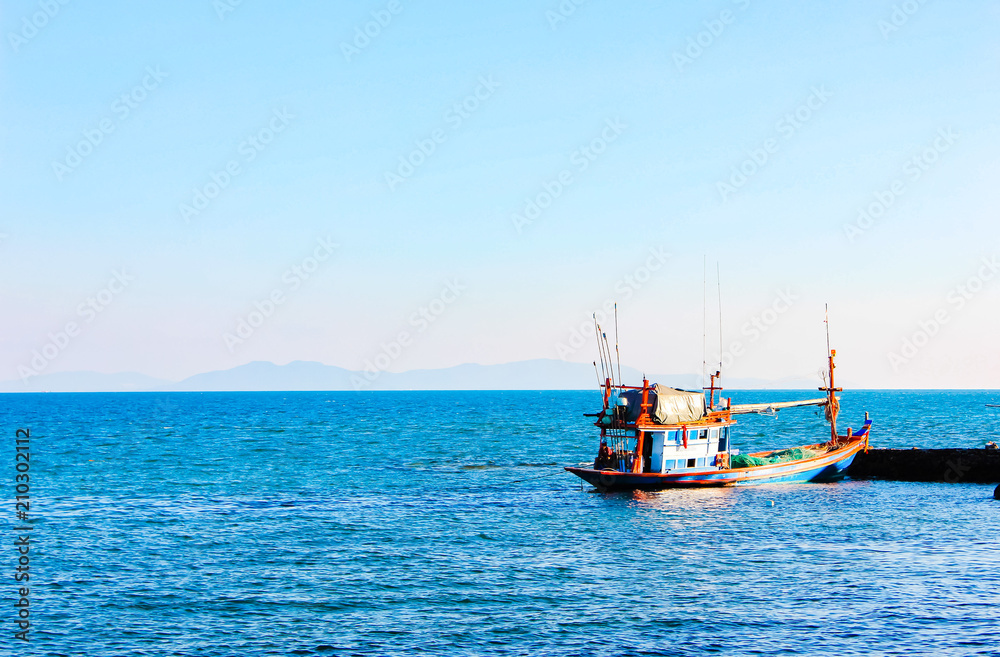 Fishing boat on the sea, Fishing boat on the sea with blue sky and white clouds.Thailand.