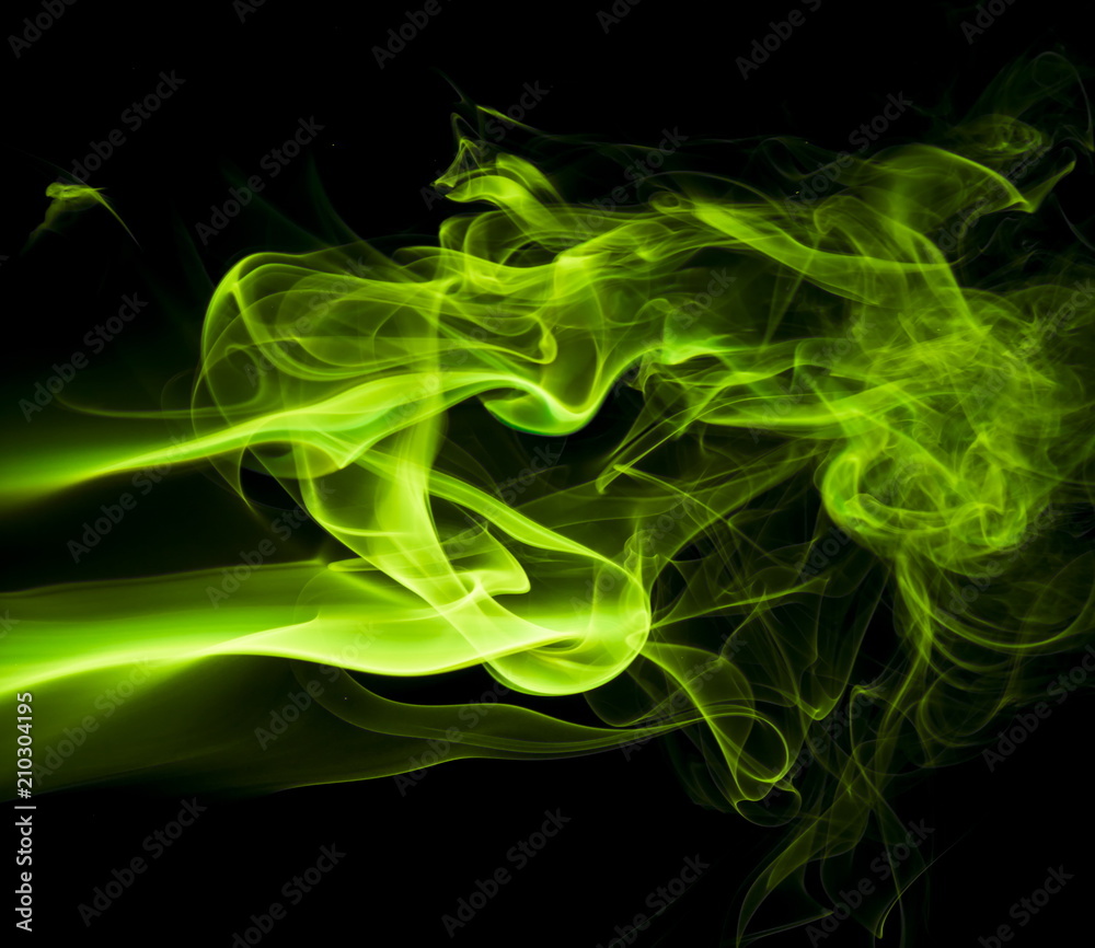 Green smoke on black background Green smoke on black background