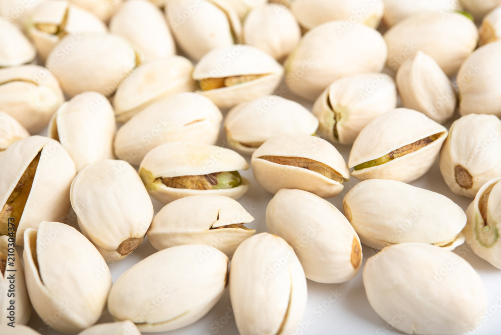 Pistachio nuts arranges as background