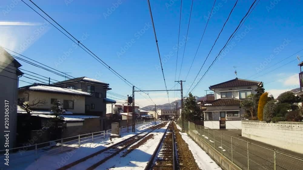 transportation and travel concept - view to suburb of nagano from moving train or railway in japan transportation and travel concept - view to suburb of nagano from moving train or railway in japan