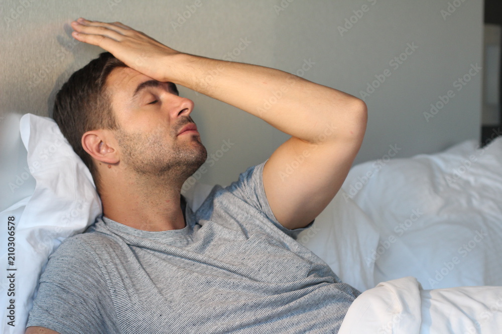 Distraught man with hand in forehead Distraught man with hand in forehead
