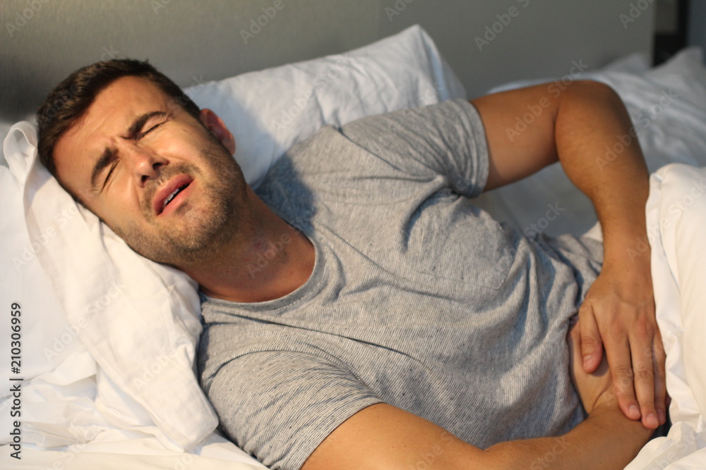 Man with stomach pain suffering Man with stomach pain suffering