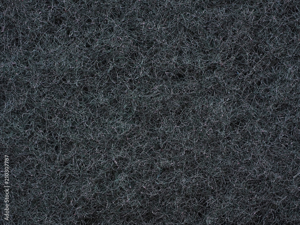 Close-up of dark gray fabric fibrous texture. A plurality of fibers are woven together and form a single surface structure. Good wallpaper or background for many tasks. Macro photography Close-up of dark gray fabric fibrous texture. A plurality of fibers are woven together and form a single surface structure. Good wallpaper or background for many tasks. Macro photography