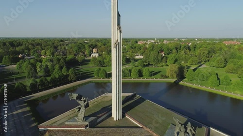 Riga city Victory monument near Old townwith roads and cars traffic Drone flight photo