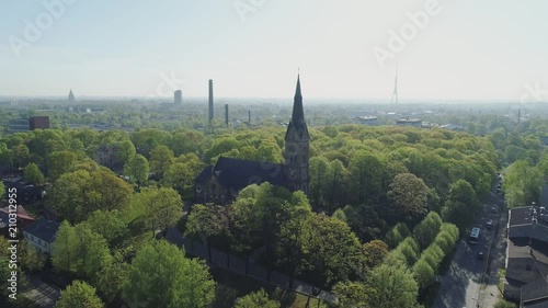 Old Church in Riga city historical Europe town sunset and building with roads and cars traffic Drone flight photo