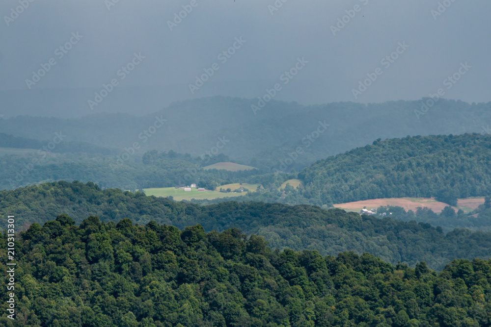 Farmland seen in distance with West Virginia hills.