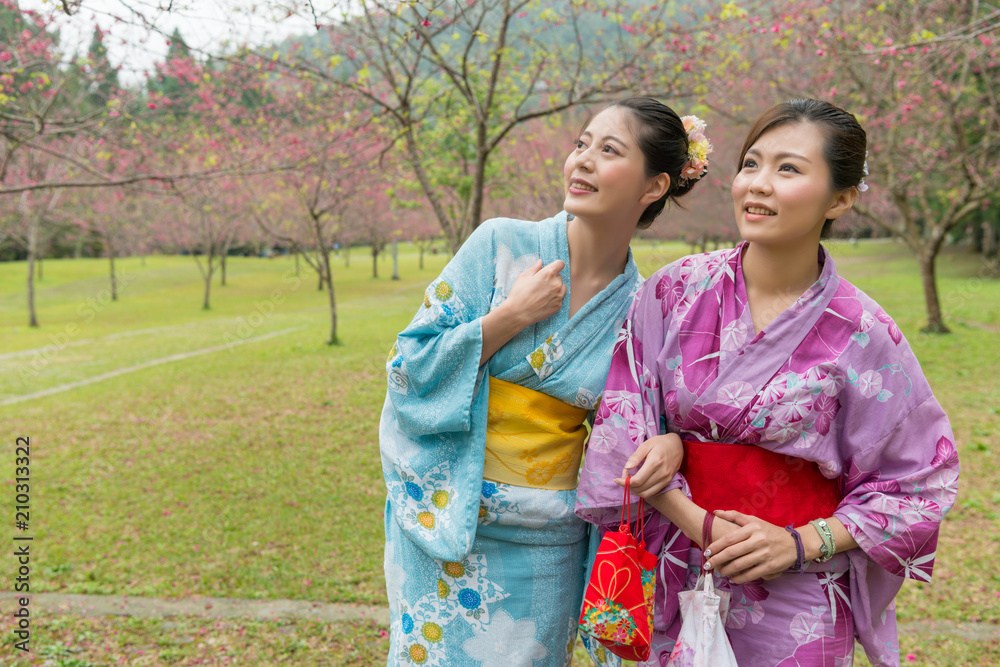 young Asian females holds hands together on loan