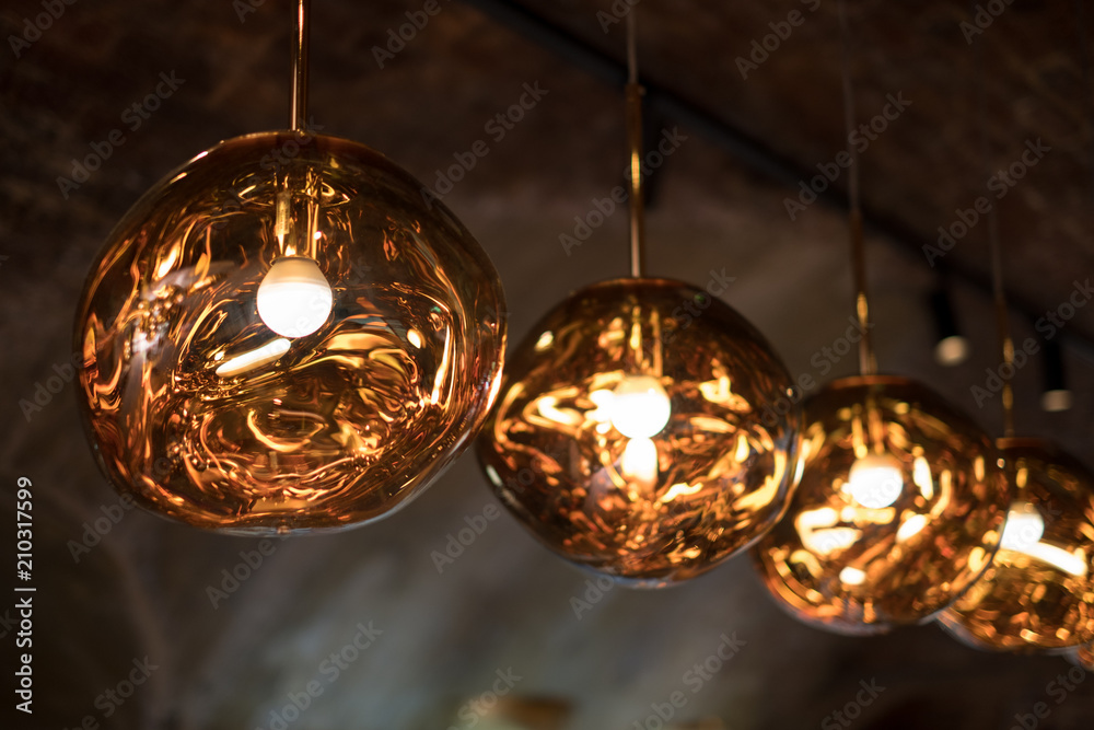 Fotka „Row of Tom Dixon spherical metallic pendant lights hanging in the  Tom Dixon flagship store and showroom at Coal Drops Yard, Kings Cross,  London UK“ ze služby Stock | Adobe Stock