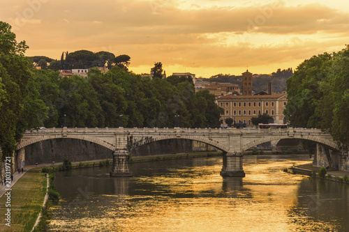 Bridge over the river Tiber in Rome at sunset
