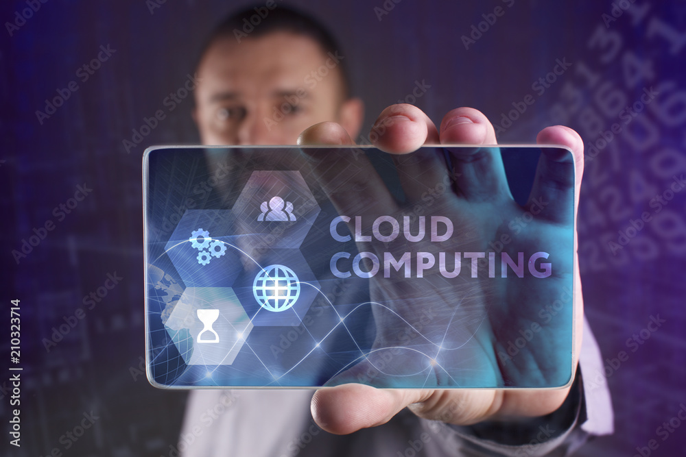 Fototapeta premium The concept of business, technology, the Internet and the network. A young entrepreneur working on a virtual screen of the future and sees the inscription: Cloud computing