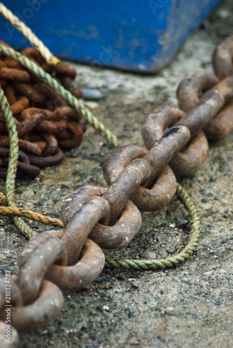 Rusty anchor chain on the ground