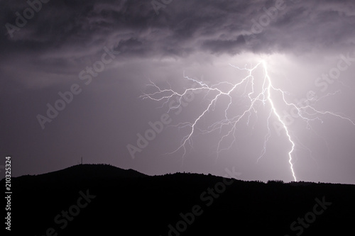 Allariz, Galicia / Spain - Jun 21 2018: lightning strike during a thunderstorm.