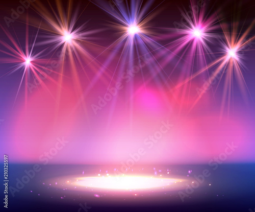 Spotlight on stage with smoke and light.
