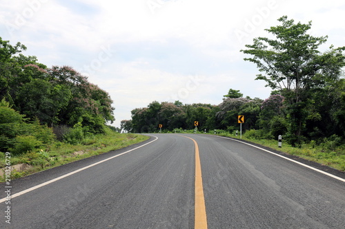 road, street, avenue roadway, countryside road and curve traffic signs in the left Thailand