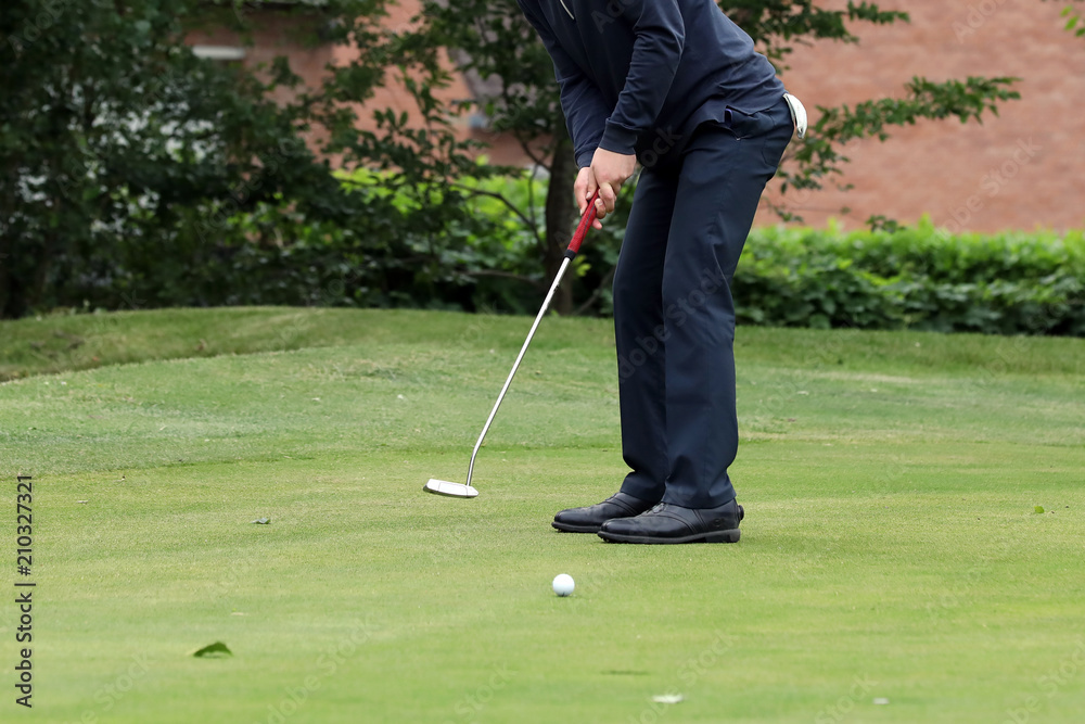 Fototapeta premium A golf player on a green
