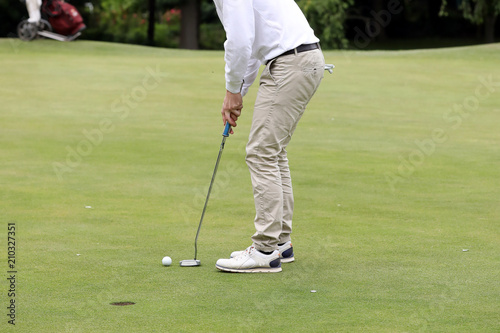 A golf player on a green