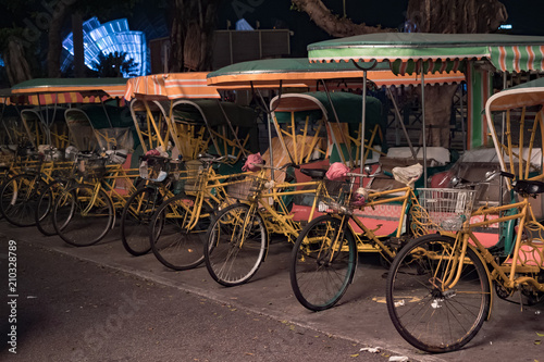 Empty typical chinese rickshaws on night street of Macau