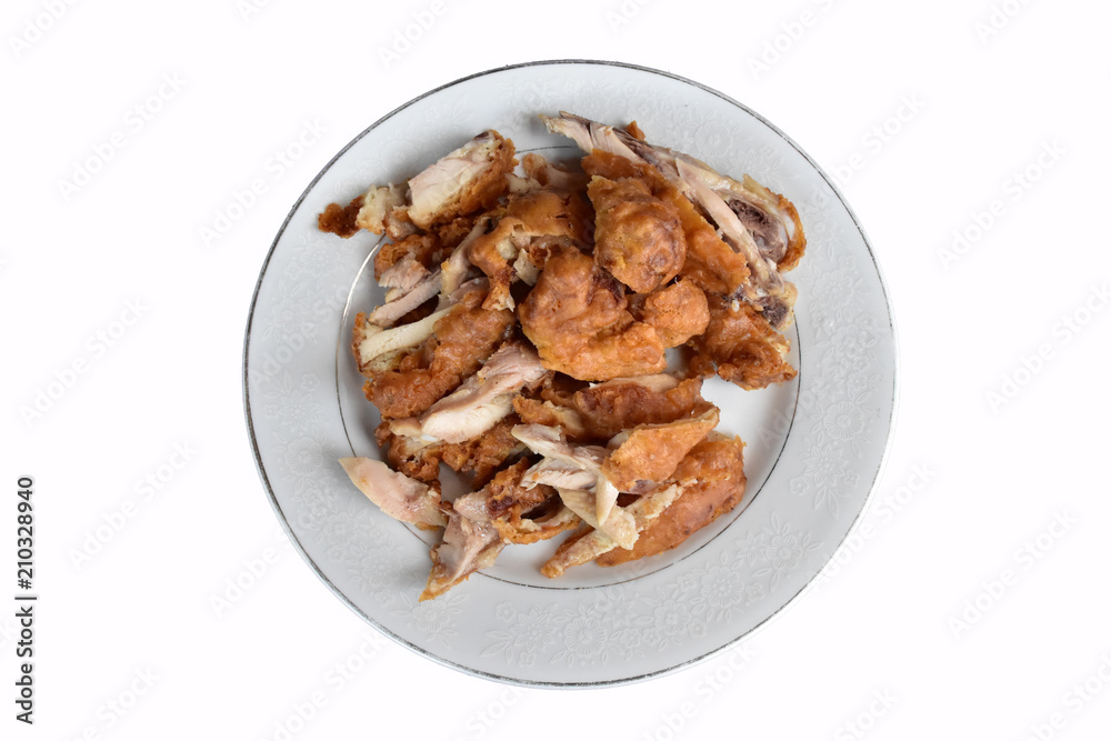 The fried chicken were choped in the white dish, isolated on white background The fried chicken were choped in the white dish, isolated on white background
