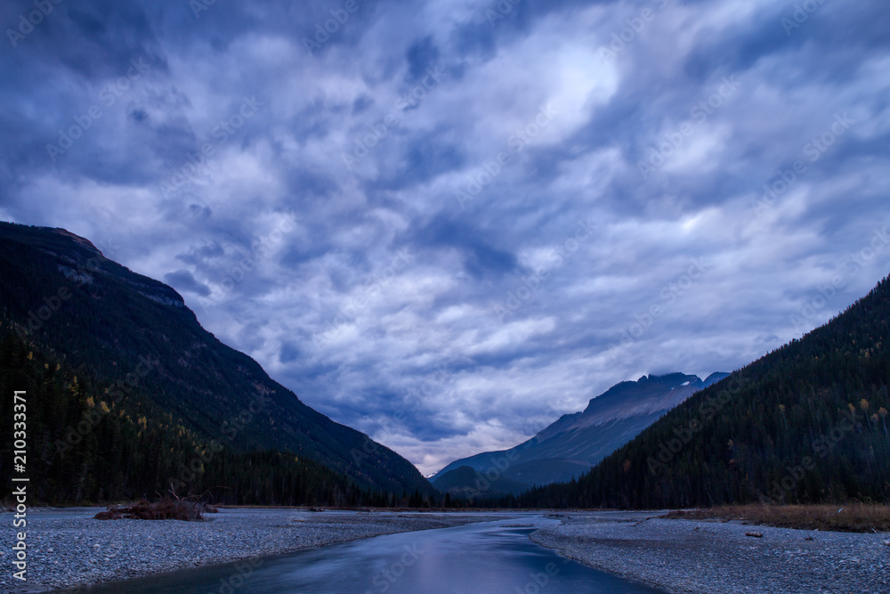 Mountain River in the Canadian Rocky Mountains, British Columbia, Canada in later afternoon light.