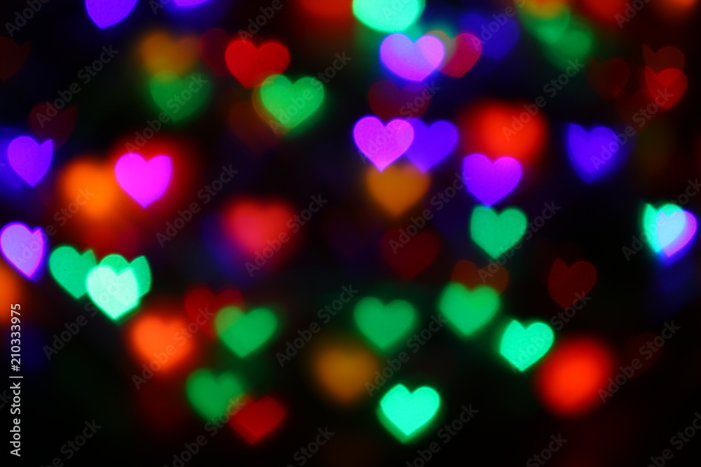 Naklejka premium Walentynki Kolorowy bokeh w kształcie serca na czarnym tle oświetlenie bokeh do dekoracji w nocy tło tapeta rozmycie valentine, miłość zdjęcia tło, oświetlenie w kształcie serca miękkie nocne streszczenie