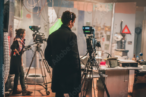 Behind scene. Multiple camera. Cameraman shooting film scene with camera photo