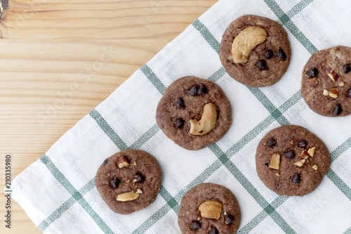 Delicious Chocolate Chip Cookies on checkered tablecloth, Tasty Homemade cookies on wooden table, dessert with . Top view and copy space