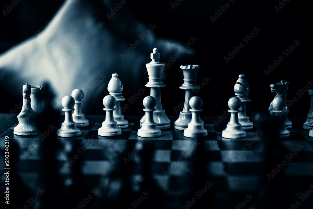 business  game competitive strategy with chess board game with blur background