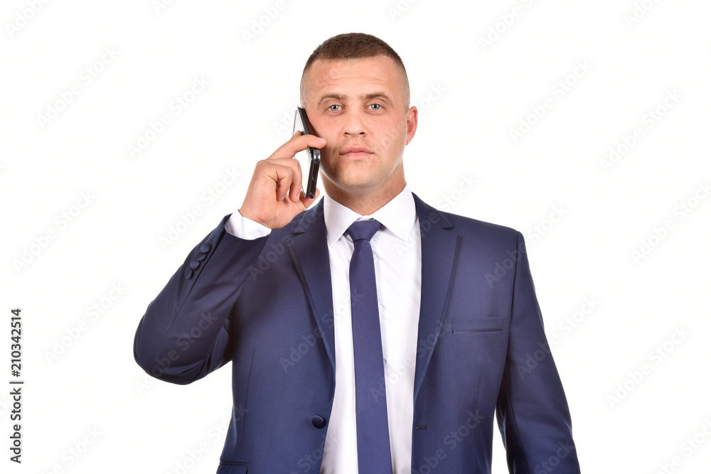 A man in a suit with a mobile phone. Confident businessman. Office worker on a white background. A man in a suit with a mobile phone. Confident businessman. Office worker on a white background.