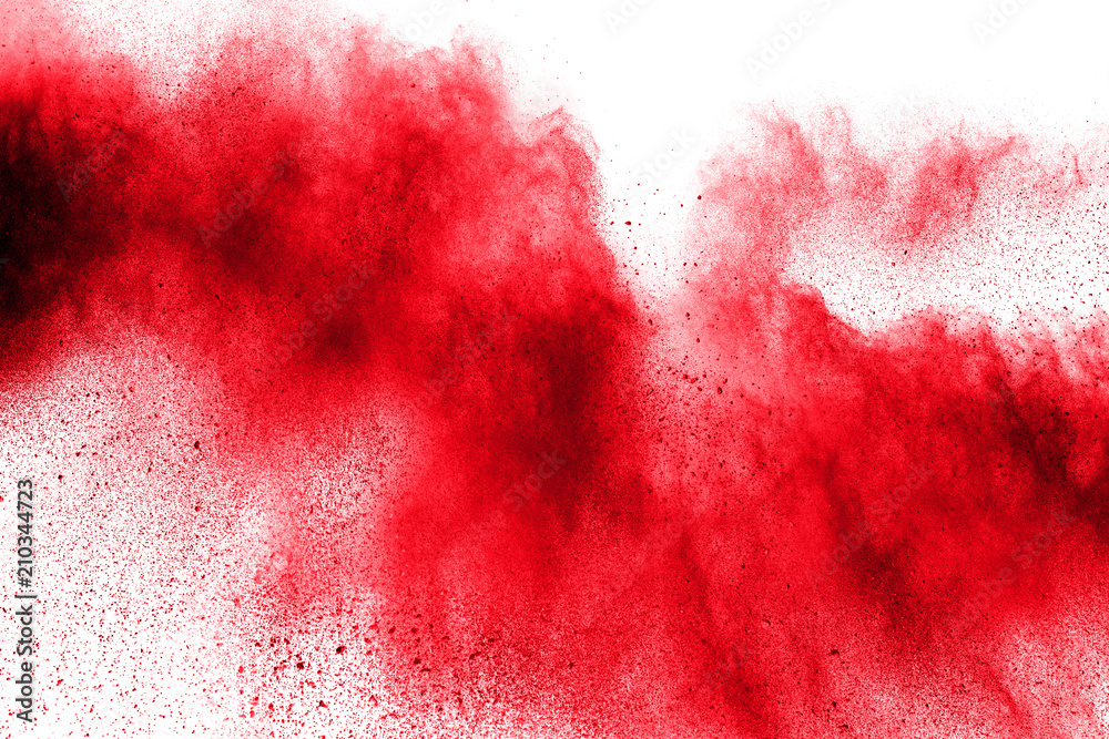 abstract red dust splattered on  white background. Red powder explosion.Freeze motion of red particles splashing.