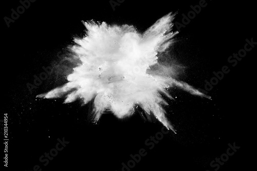 Launched white powder splash on black background.Stopping the movement of white powder on dark background.