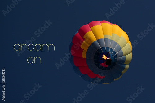 Dream on concept. Hot air balloon colorful in sky