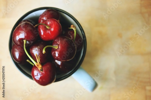 cherry in a mug from above. free space