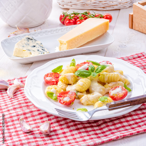 delicious gnocchi with gorgonzola cream sauce and cherry tomatoes