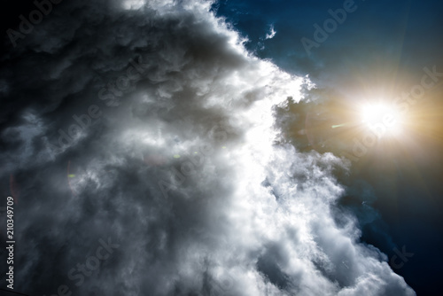 Confrontation of the weather: the sun and the clouds. Concept: the confrontation between people.