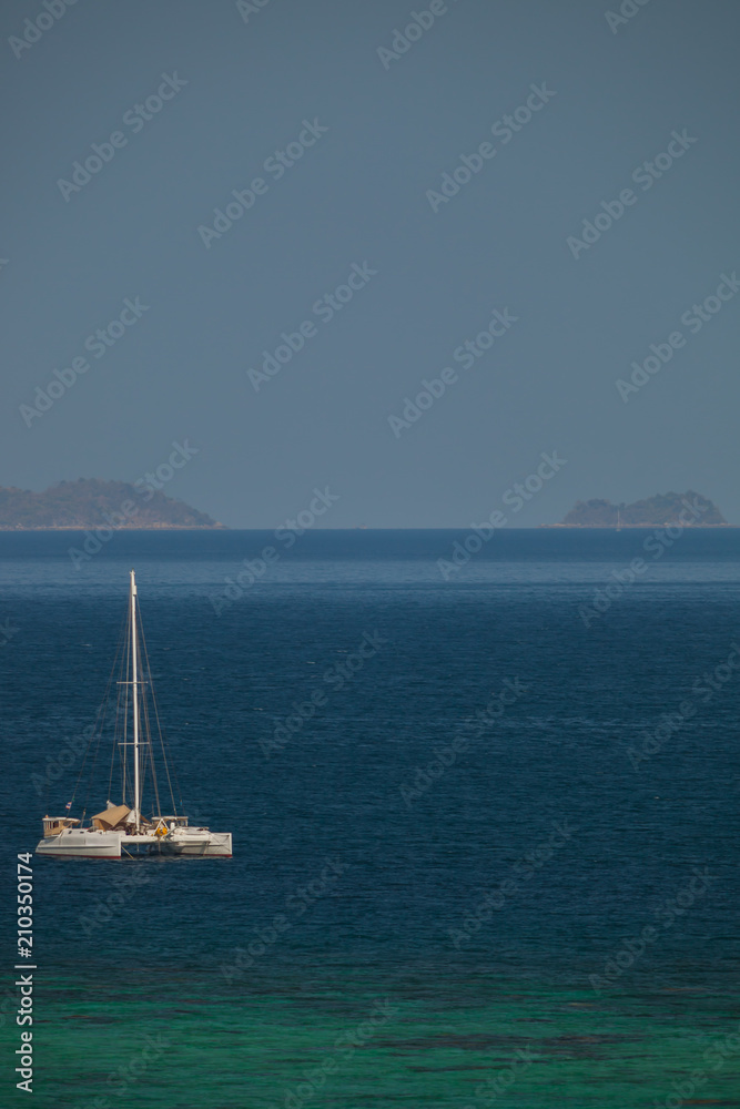 Yacht anchored in opening sea from bird eye view Yacht anchored in opening sea from bird eye view