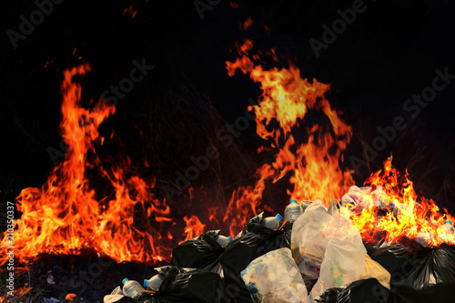 Burn a lot of waste plastic garbage, Garbage bin pile Dump Lots of junk Polluting with Plastic Burning heap of smoke from a burning pile of many garbage waste pollution