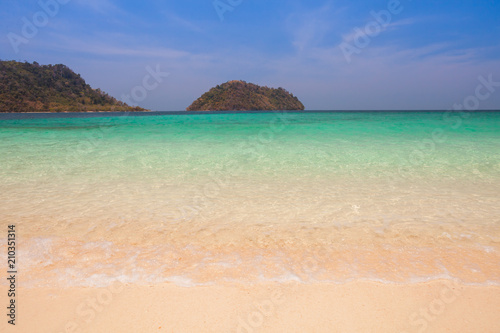 White sand beach with moutain under clear sky at ocean in Tropicana located at south of Thailand 